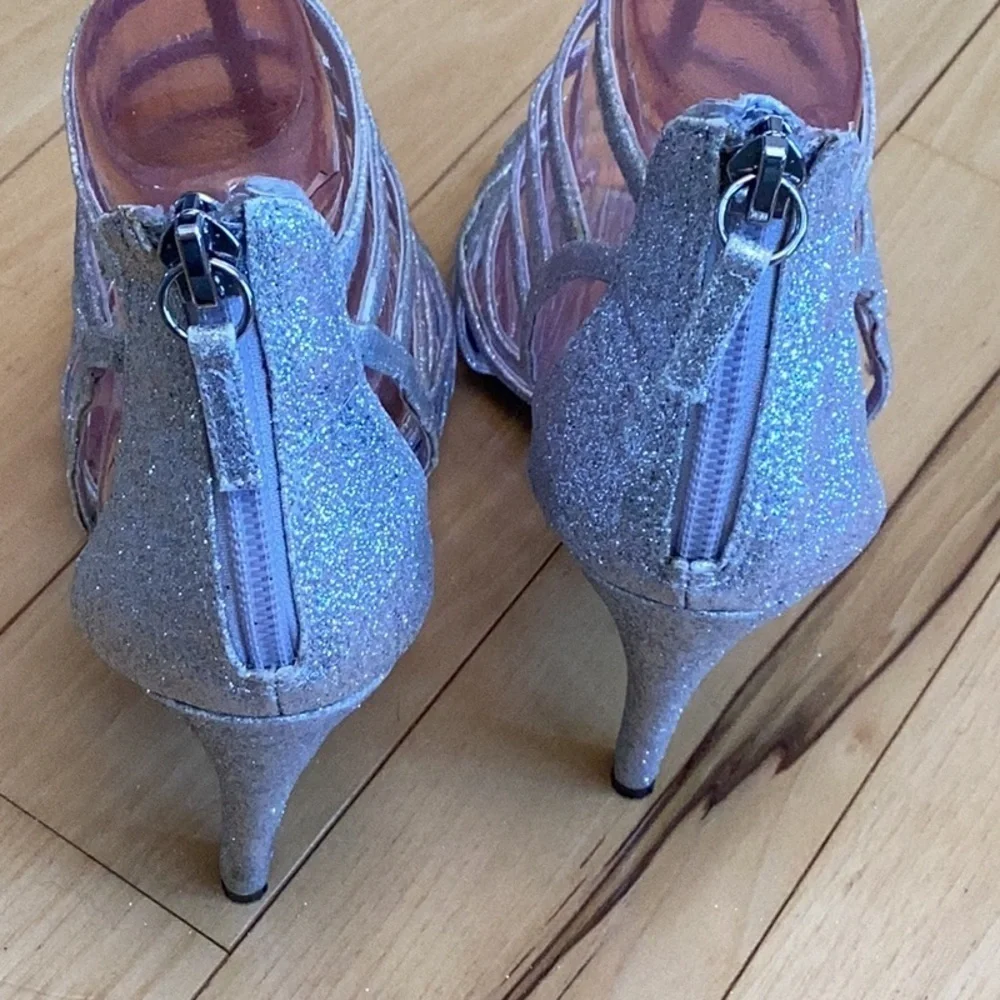 Nina silver glittery, strappy high heels, zipper to back. Women’s size 7